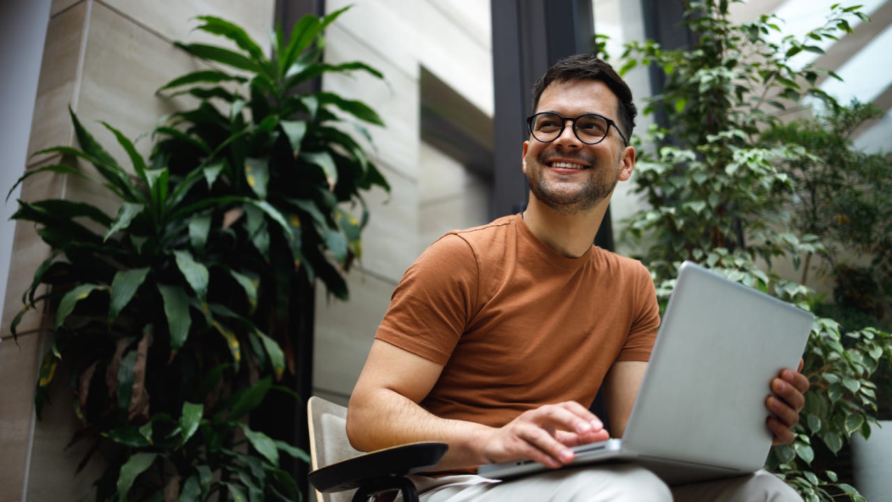 Happy man on laptop